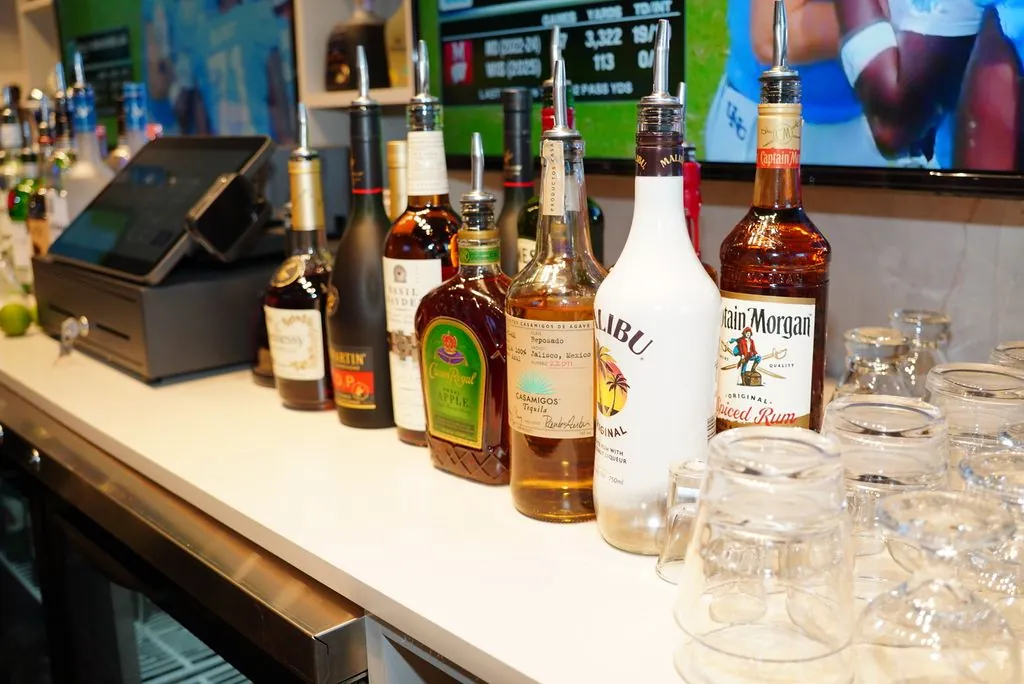 Bottles along the back bar, the counter clear